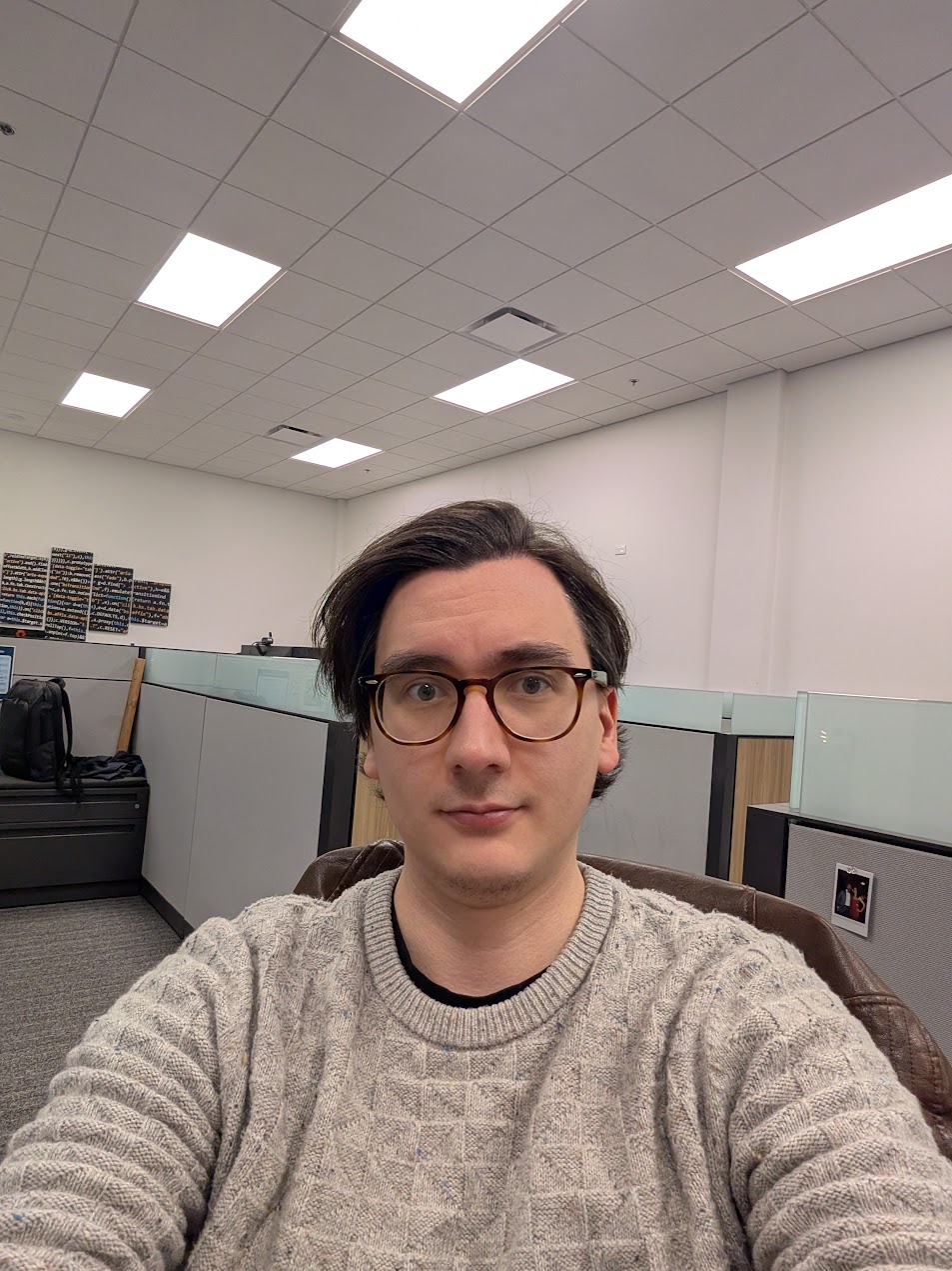 Alex Olvera at his desk in the office